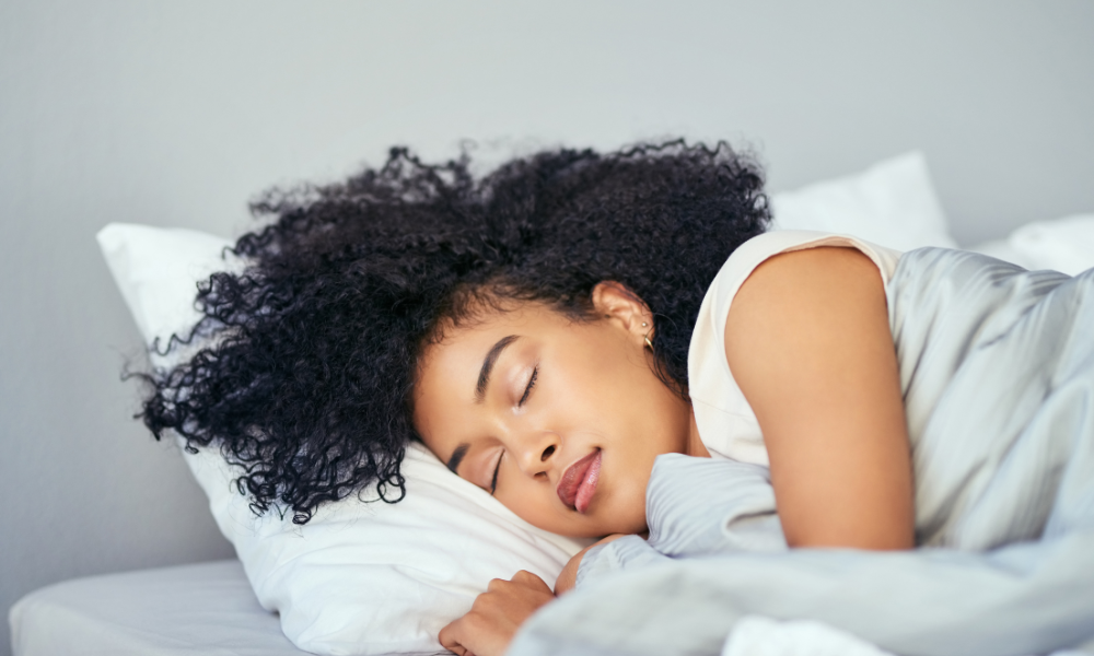 Woman receiving a restful sleep after working with The Sleep Institute