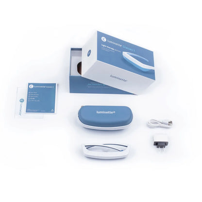 Luminette 3 Light Therapy Glasses with packaging and accessories on a white background 