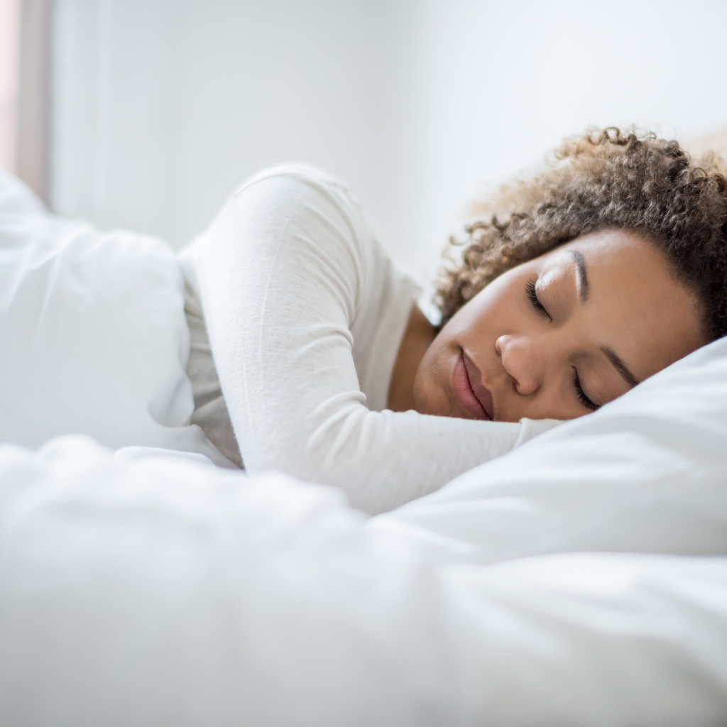 Woman enjoying a restful sleep through The Sleep Institute